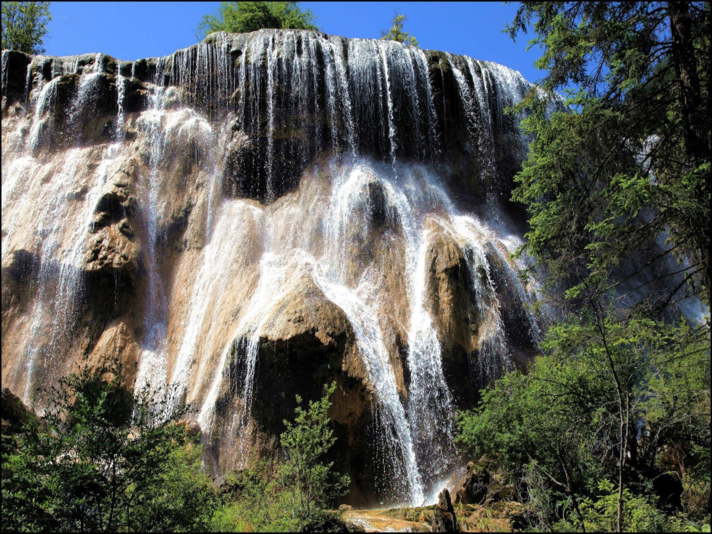 Waterfall cascading over rock face