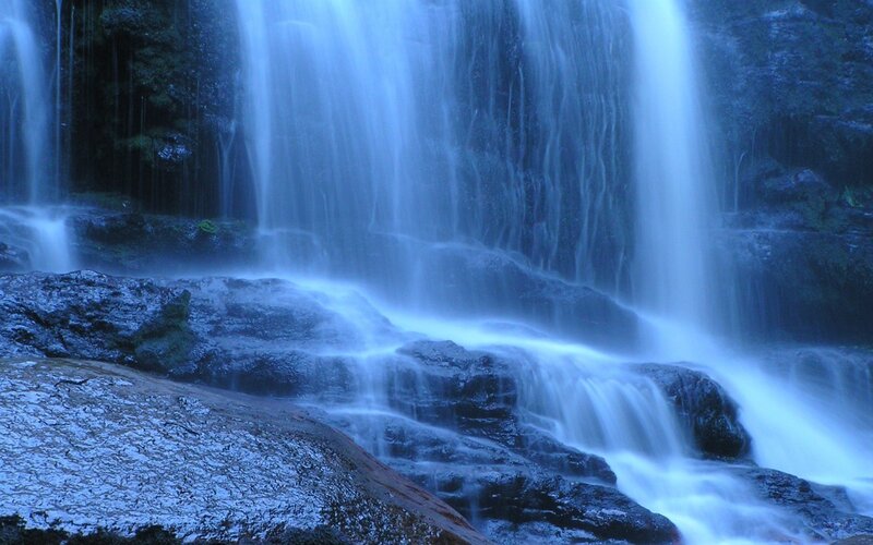 Waterfall Cascading over Rocks — Blue, Serene