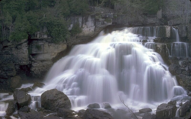 Waterfall Cascading over Rocks — White, Serene, Photograph, Trees, Cliff