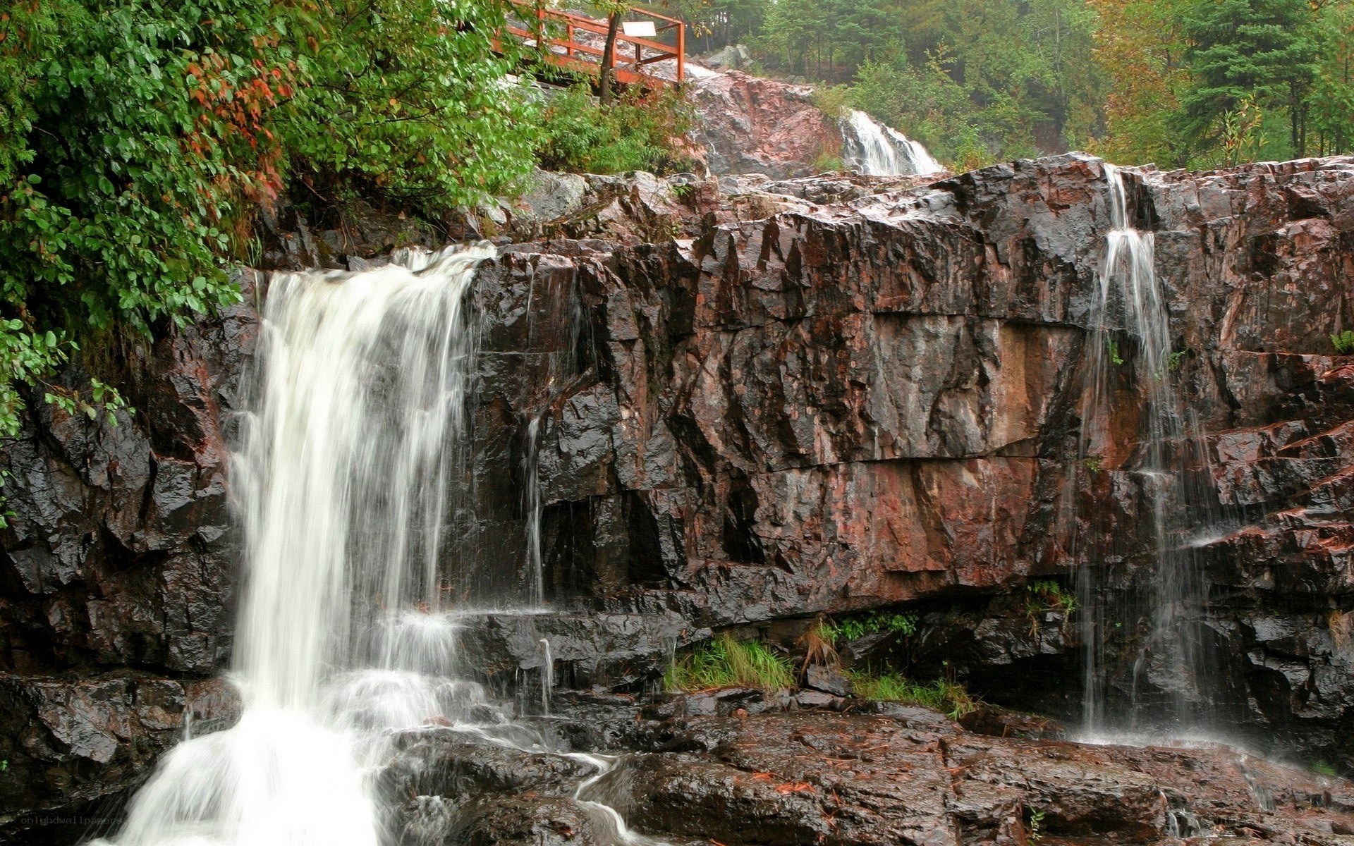 Waterfall cascading over rocky cliff