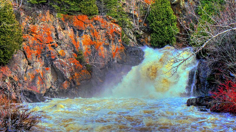 Waterfall cascading over rocky cliff