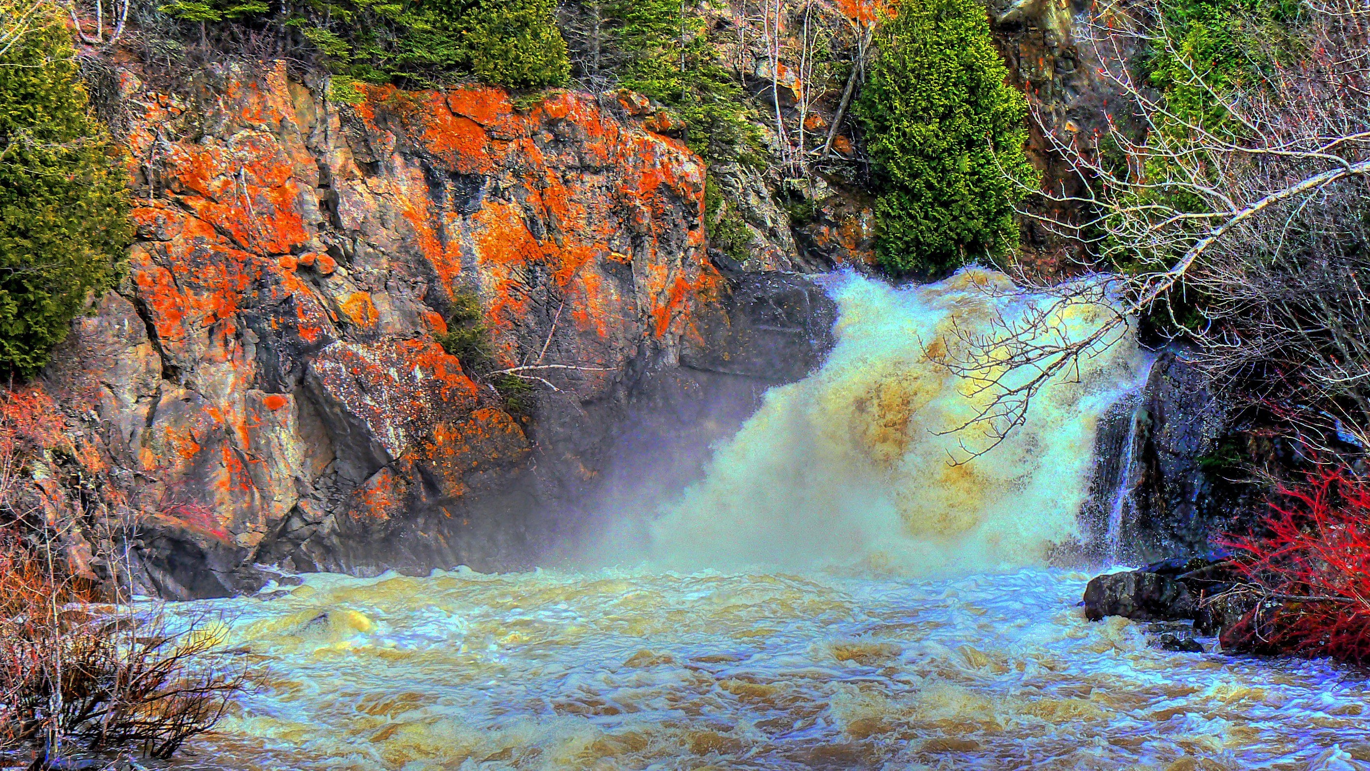 Waterfall cascading over rocky cliff