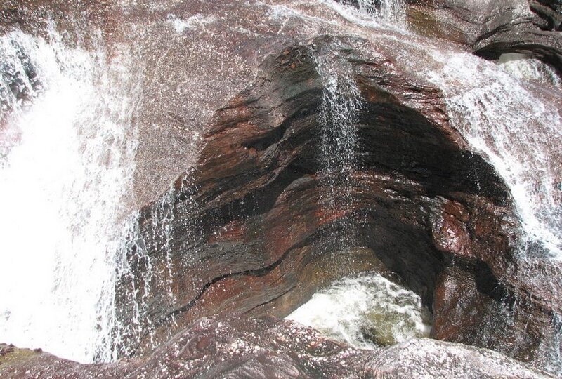 Waterfall eroding rock formation
