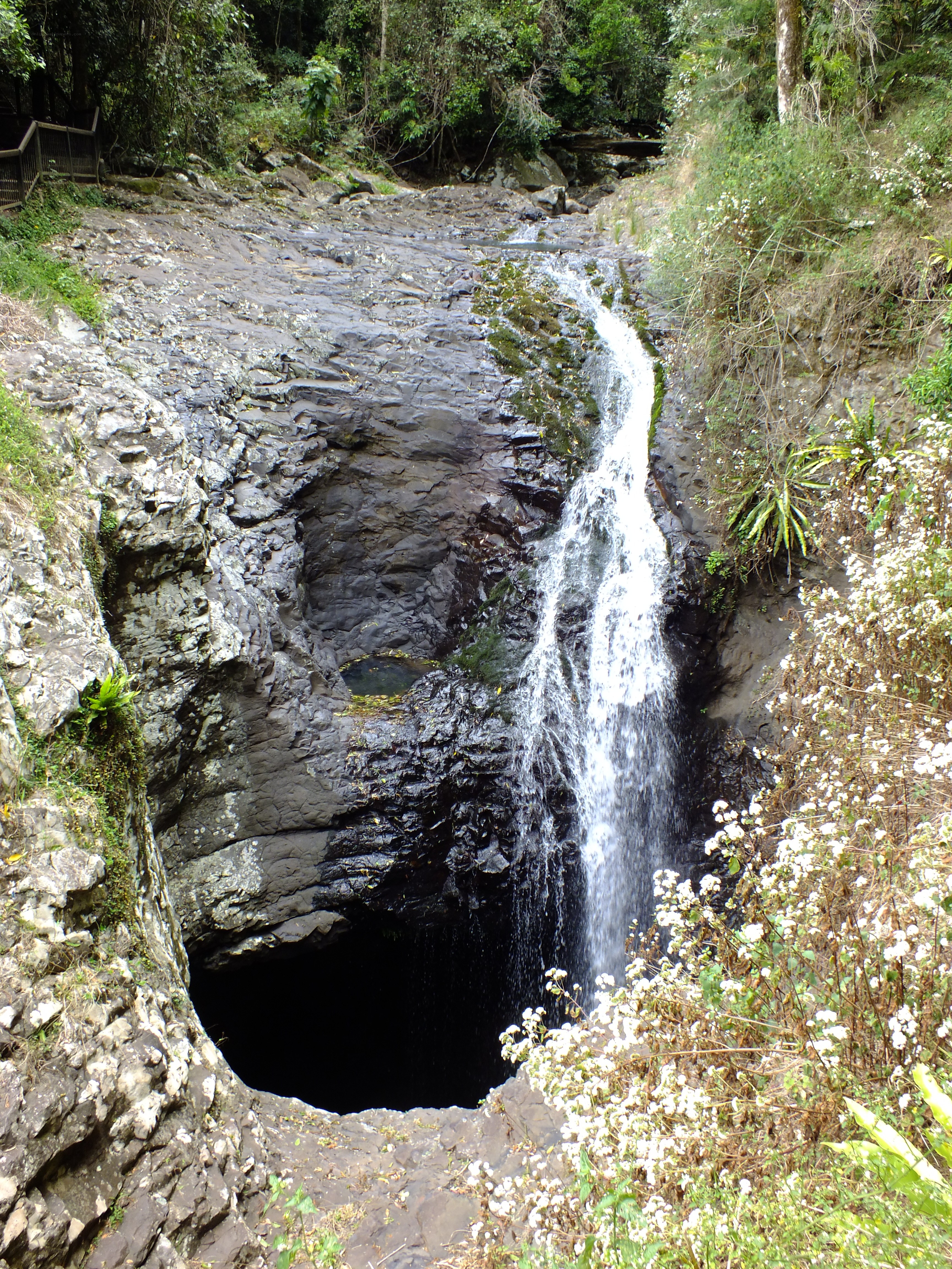 Waterfall flowing into a sinkhole