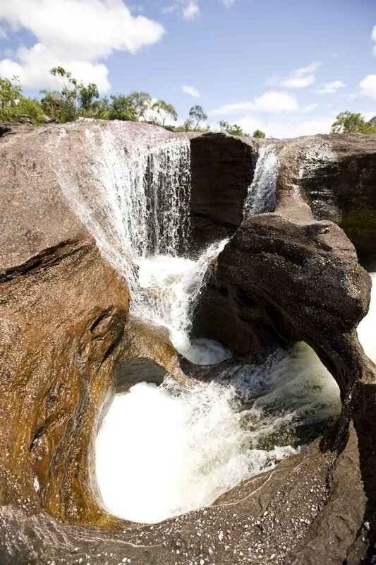 Waterfall flowing through rock formation