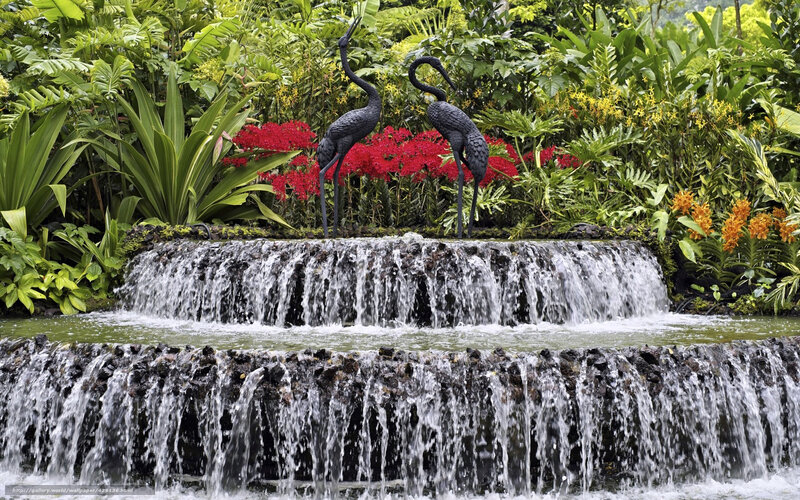 Waterfall garden with crane statues