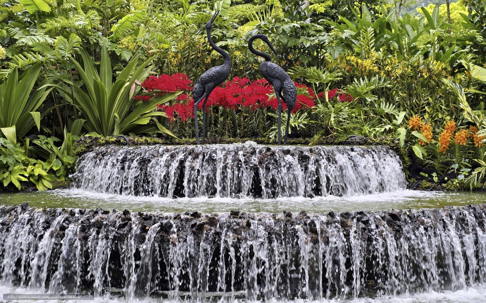 Waterfall garden with crane statues