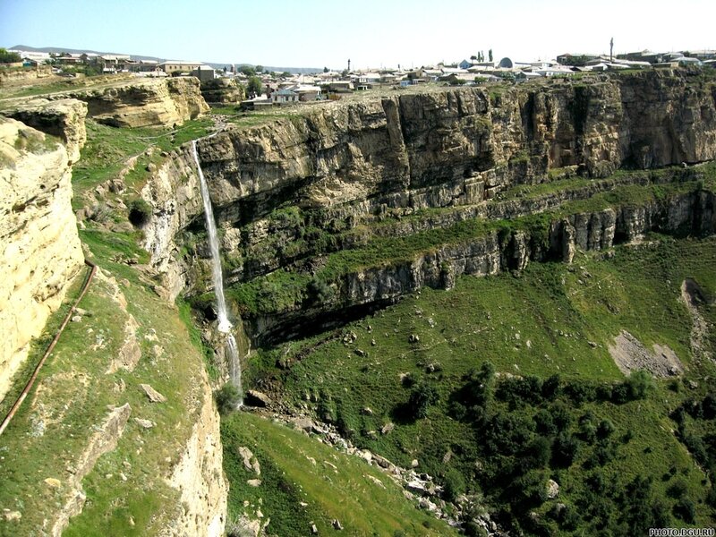 Waterfall in a canyon village