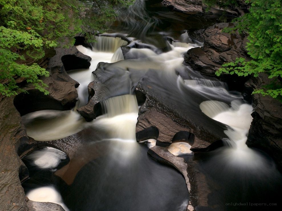 Waterfall in a forest canyon