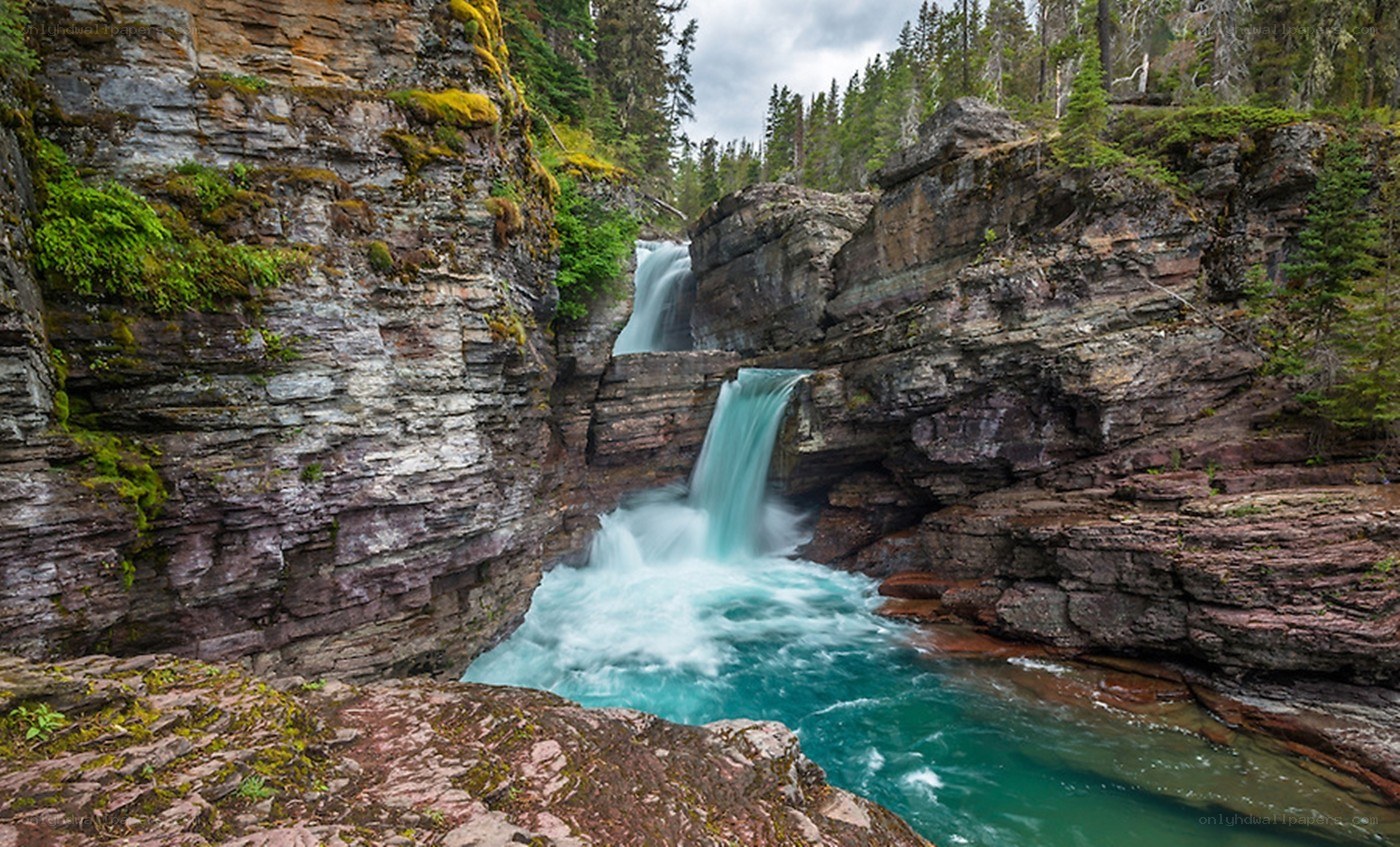 Waterfall in a forest canyon