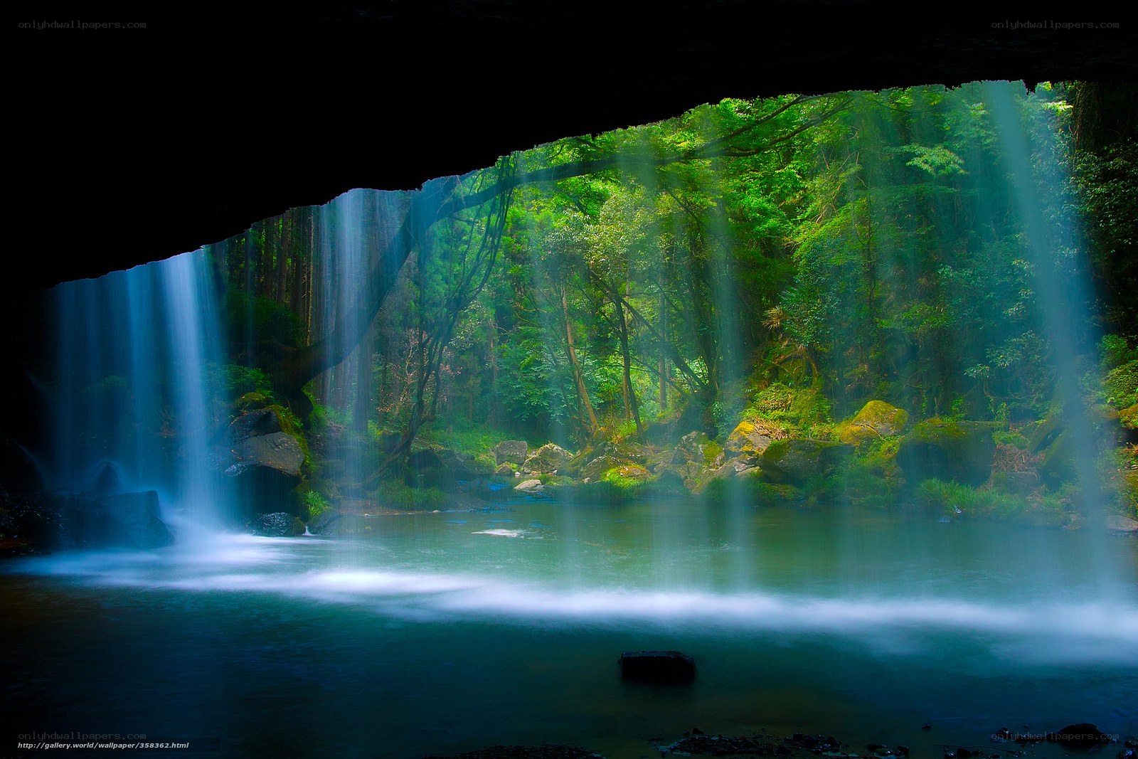 Waterfall in a forest cave