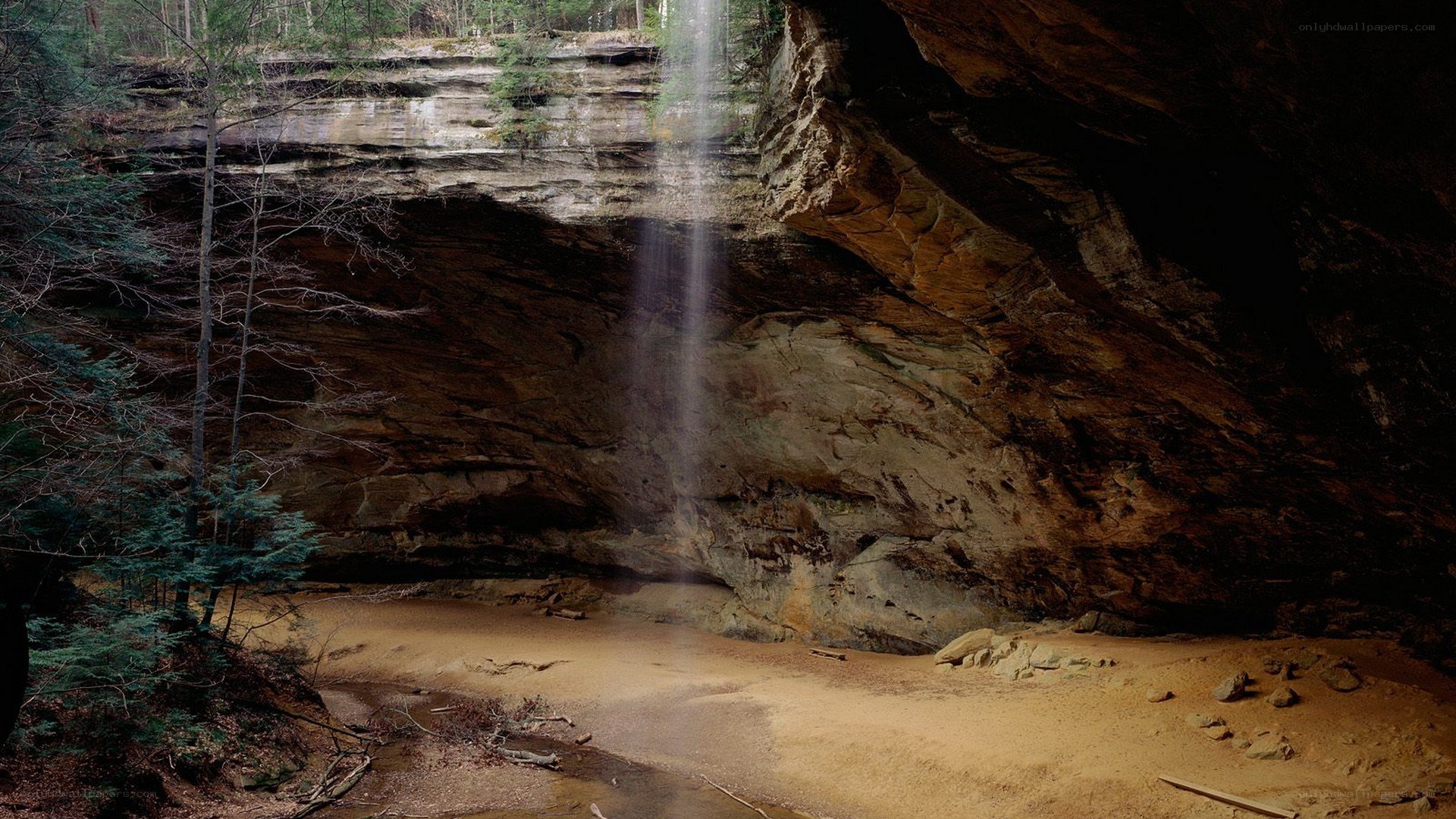 Waterfall in a forest cave