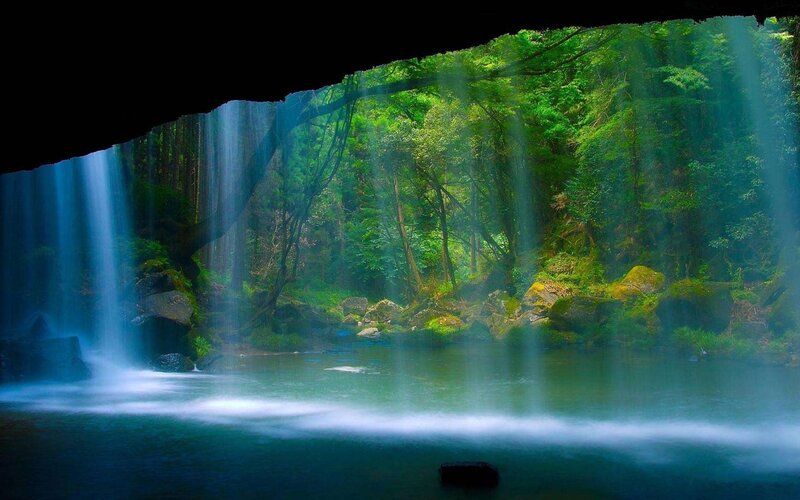 Waterfall in a forest cave