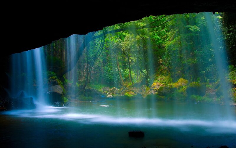 Waterfall in a forest cave