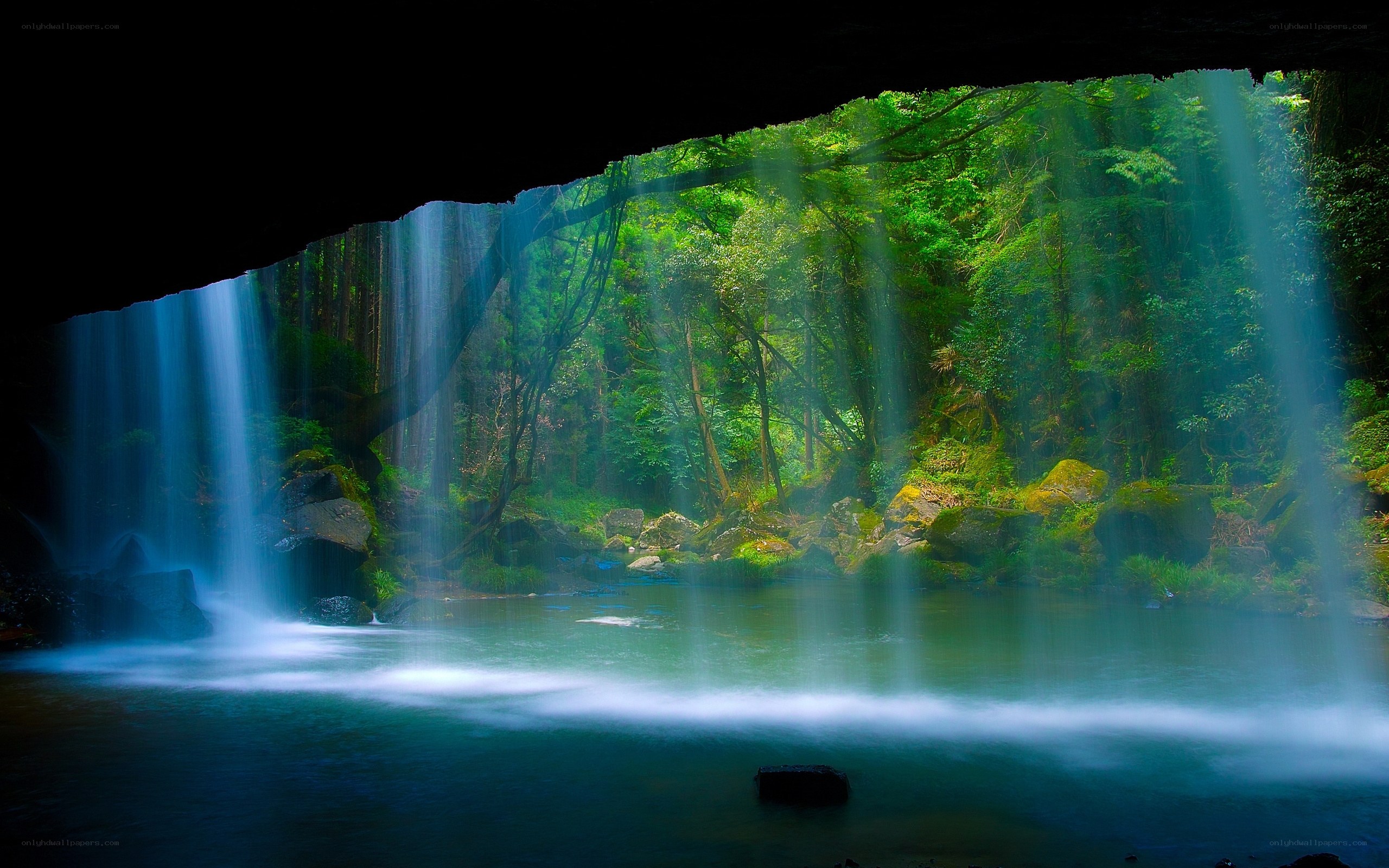 Waterfall in a forest cave