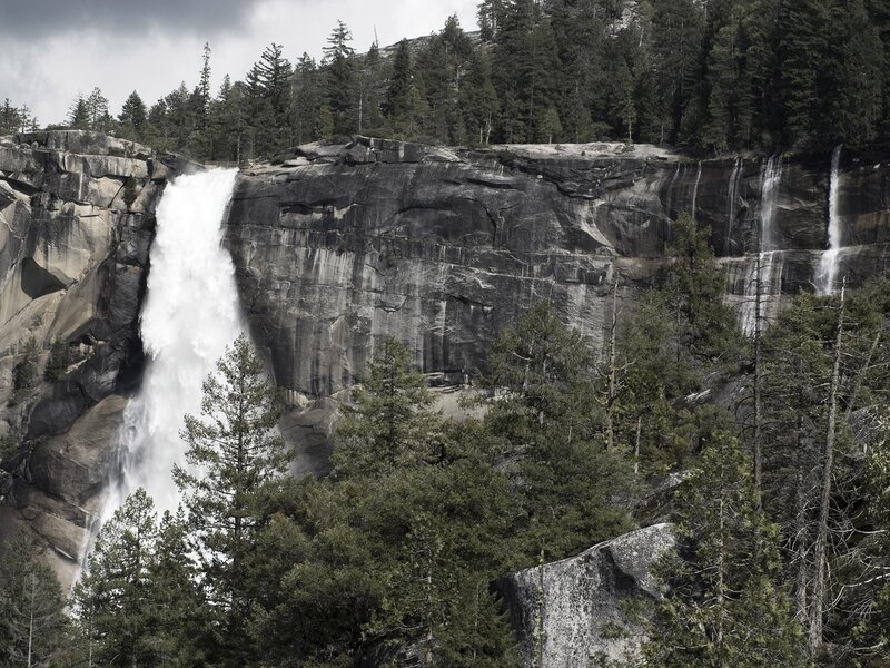 Waterfall in a forested canyon