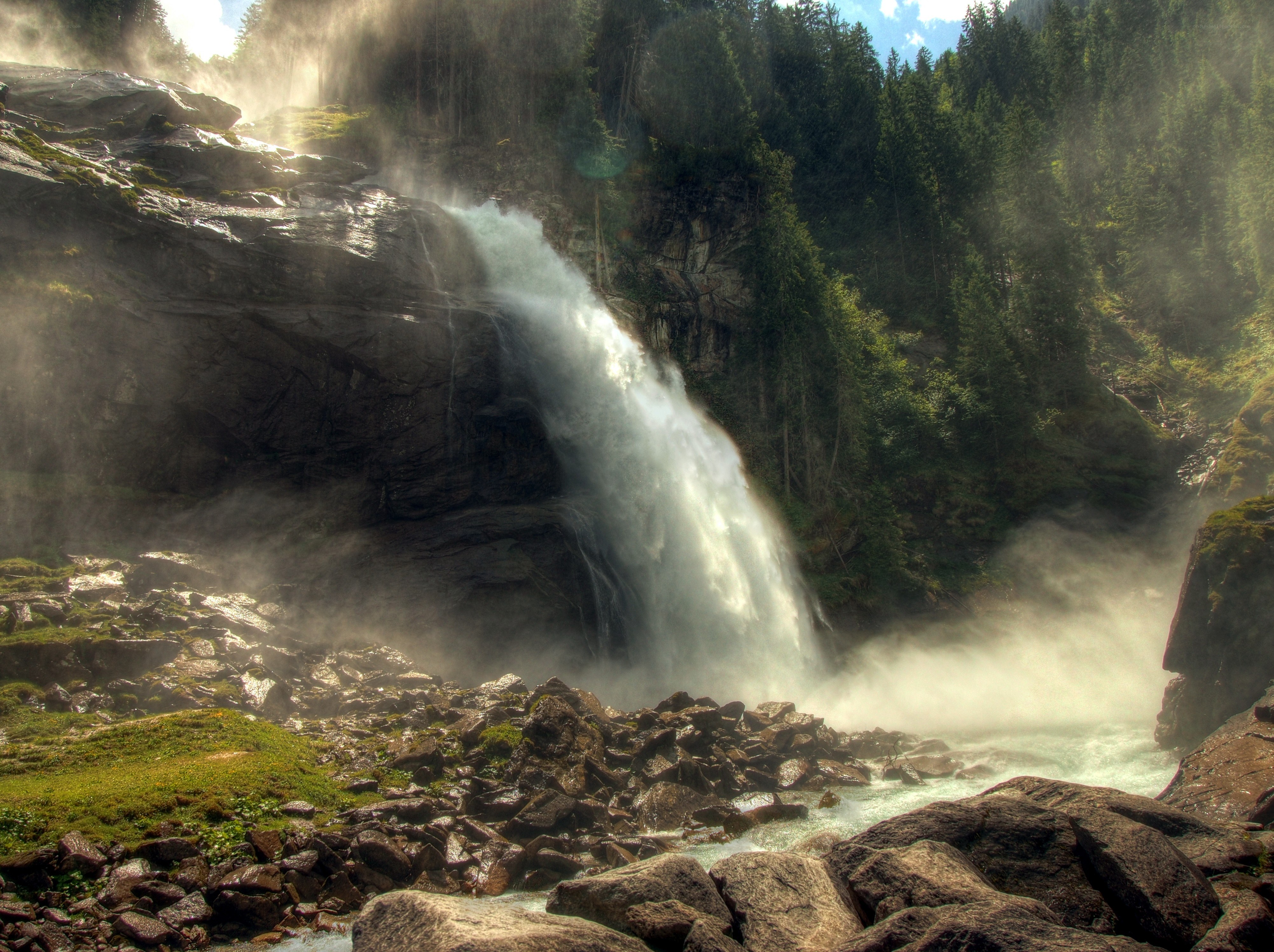 Waterfall in a forested canyon