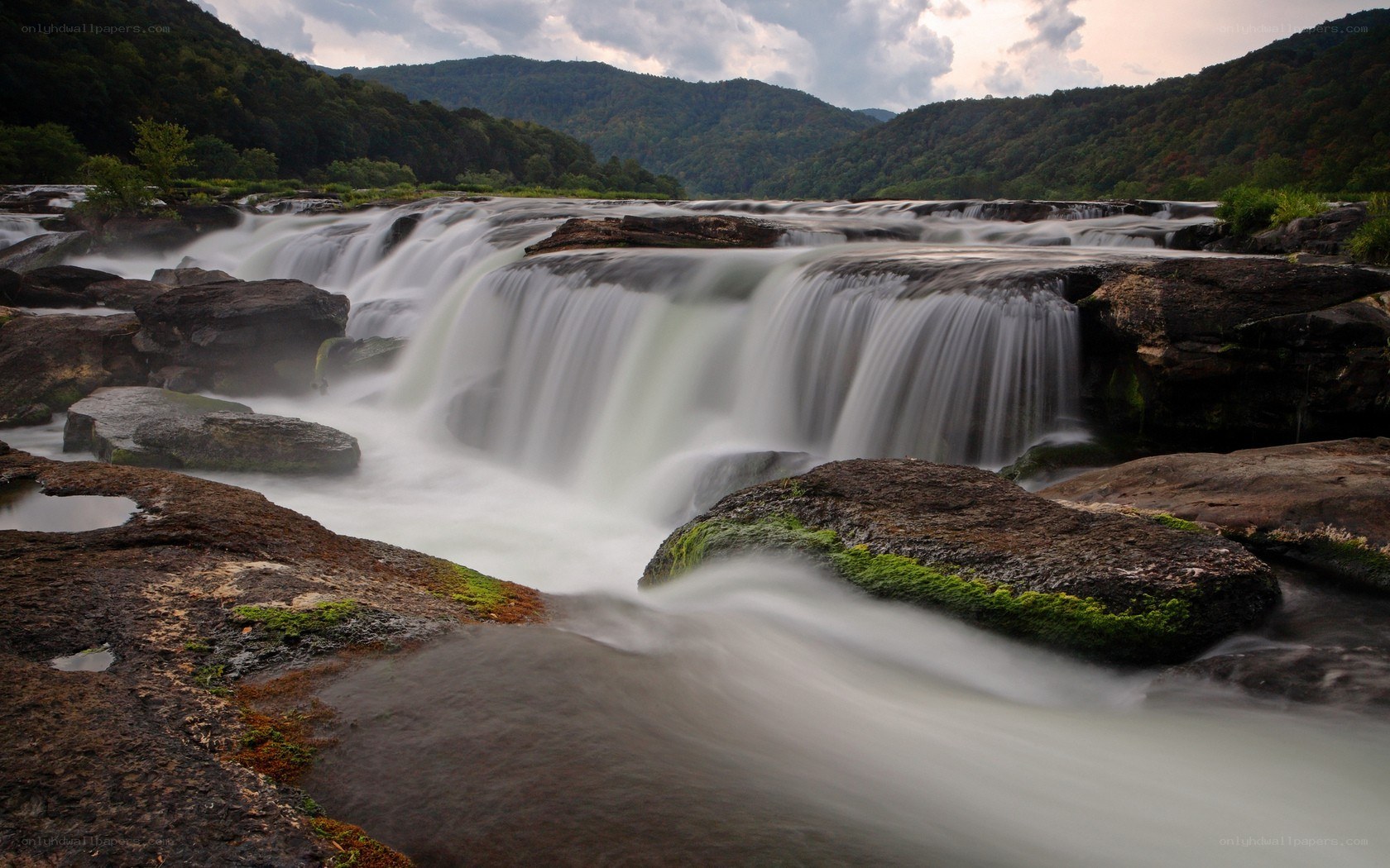 Waterfall in a forested valley