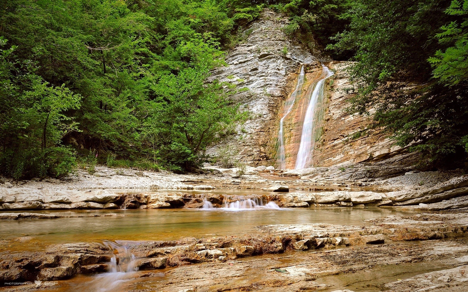 Waterfall in a forested valley