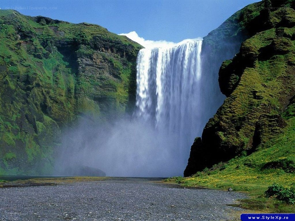 Waterfall in a green canyon