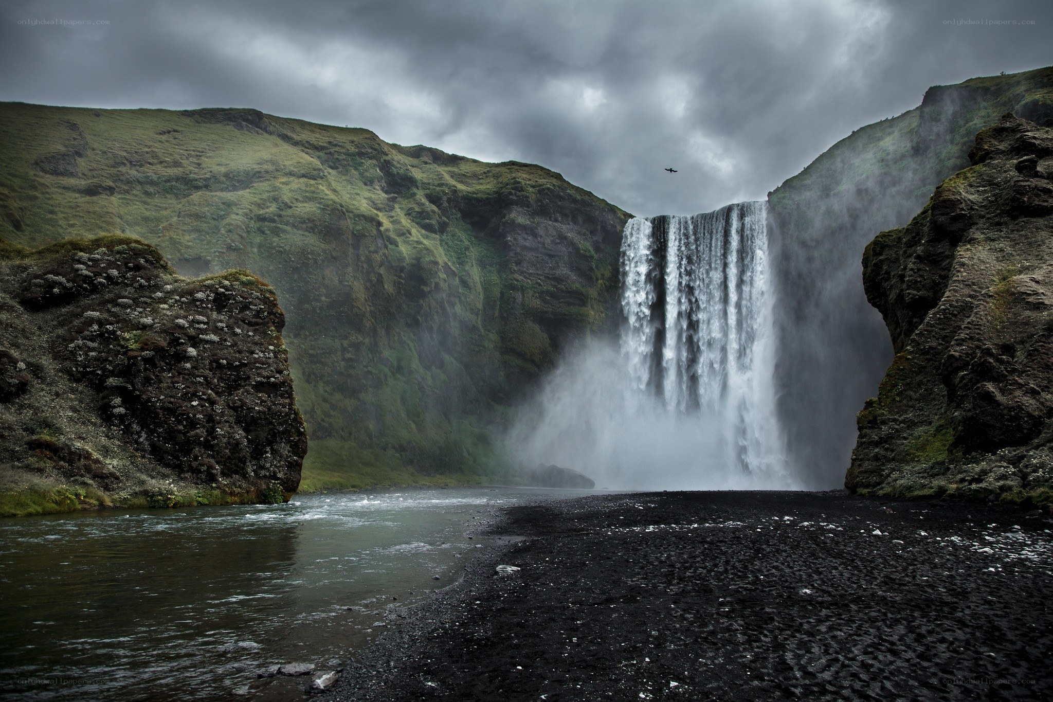 Waterfall in a green canyon