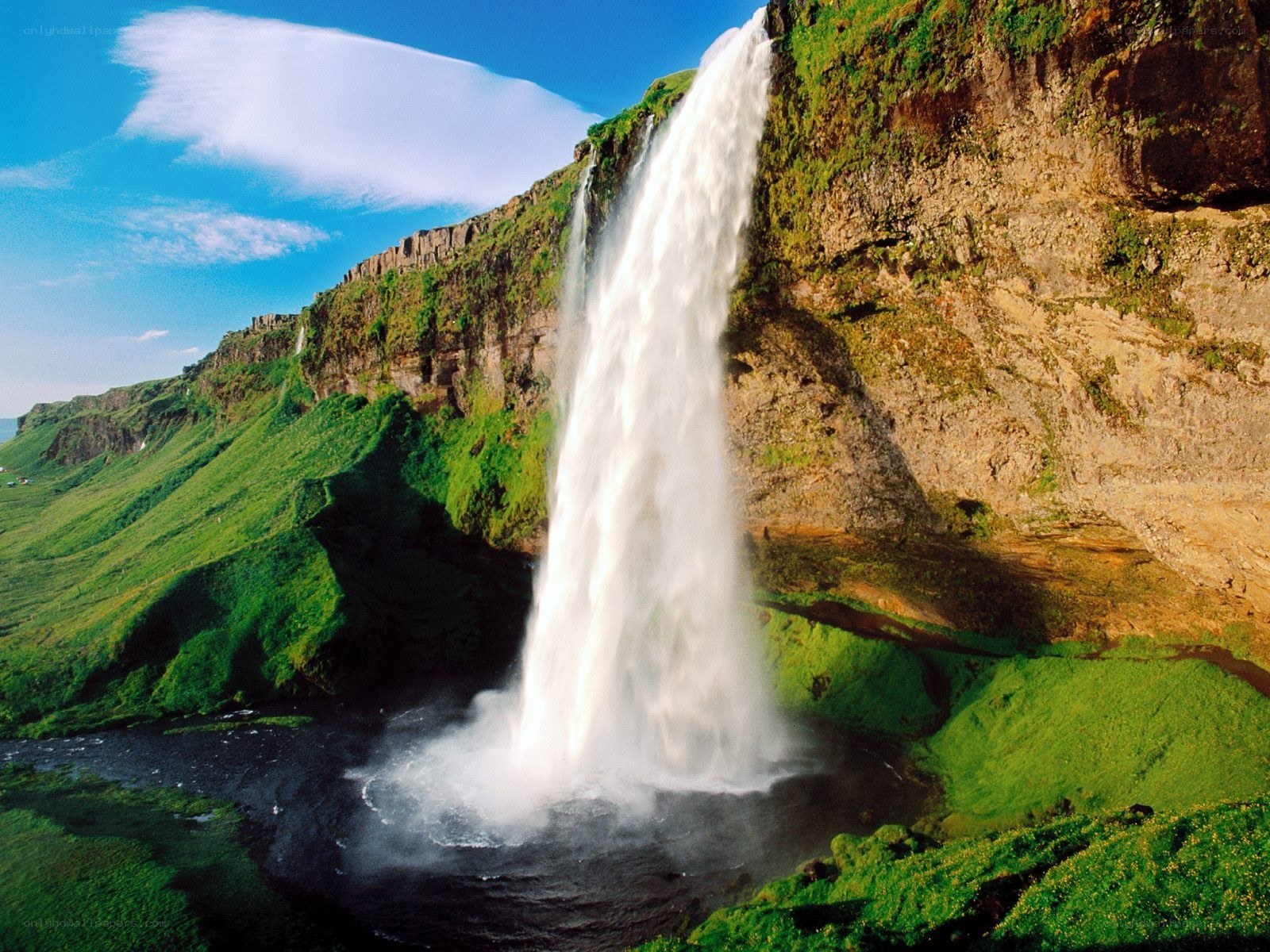 Waterfall in a green landscape
