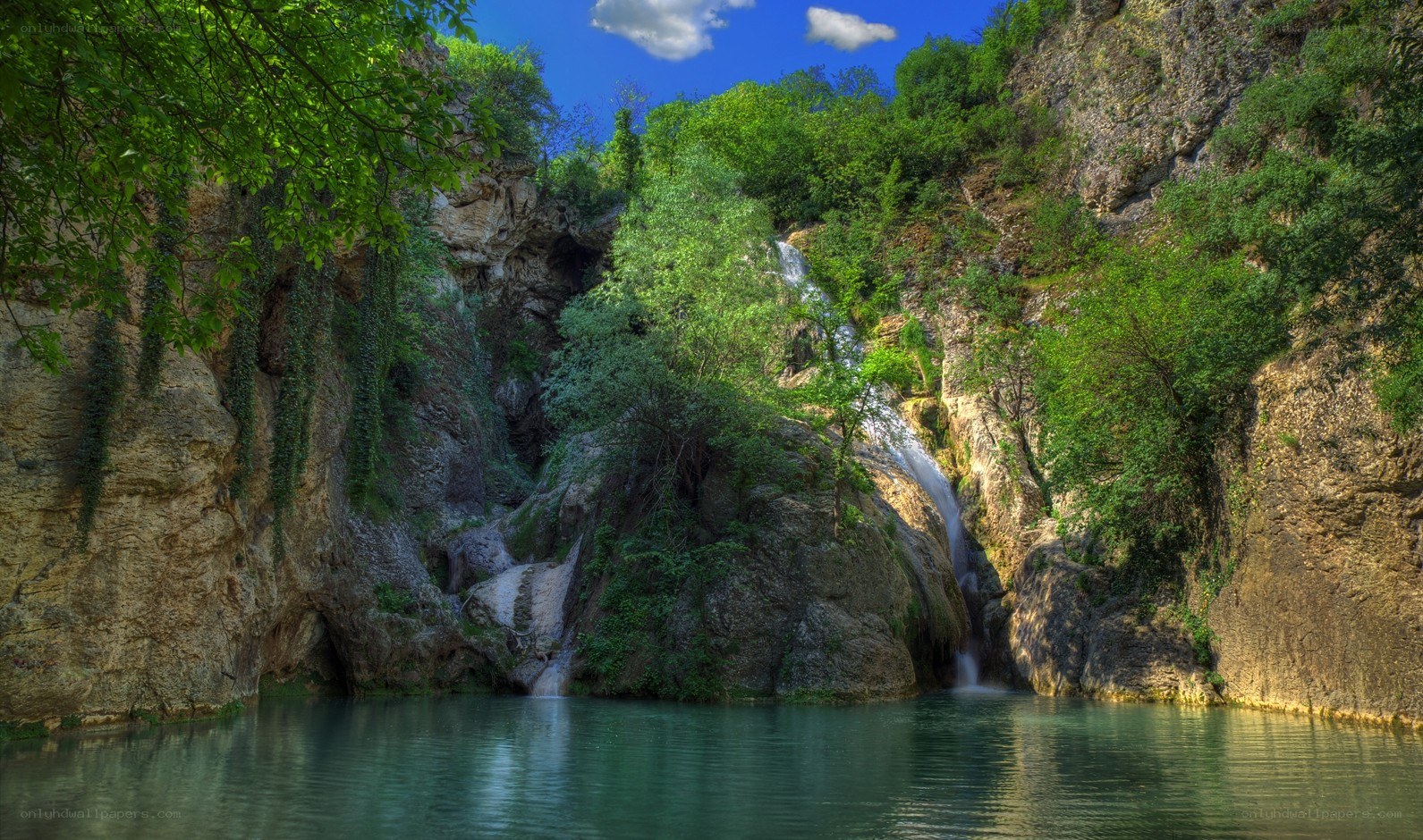 Waterfall in a lush canyon