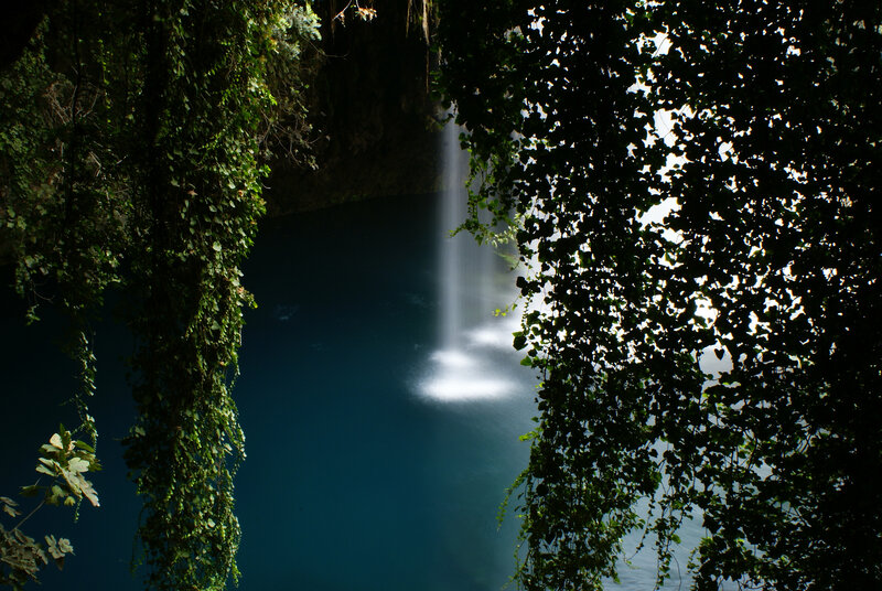 Waterfall in a lush cave
