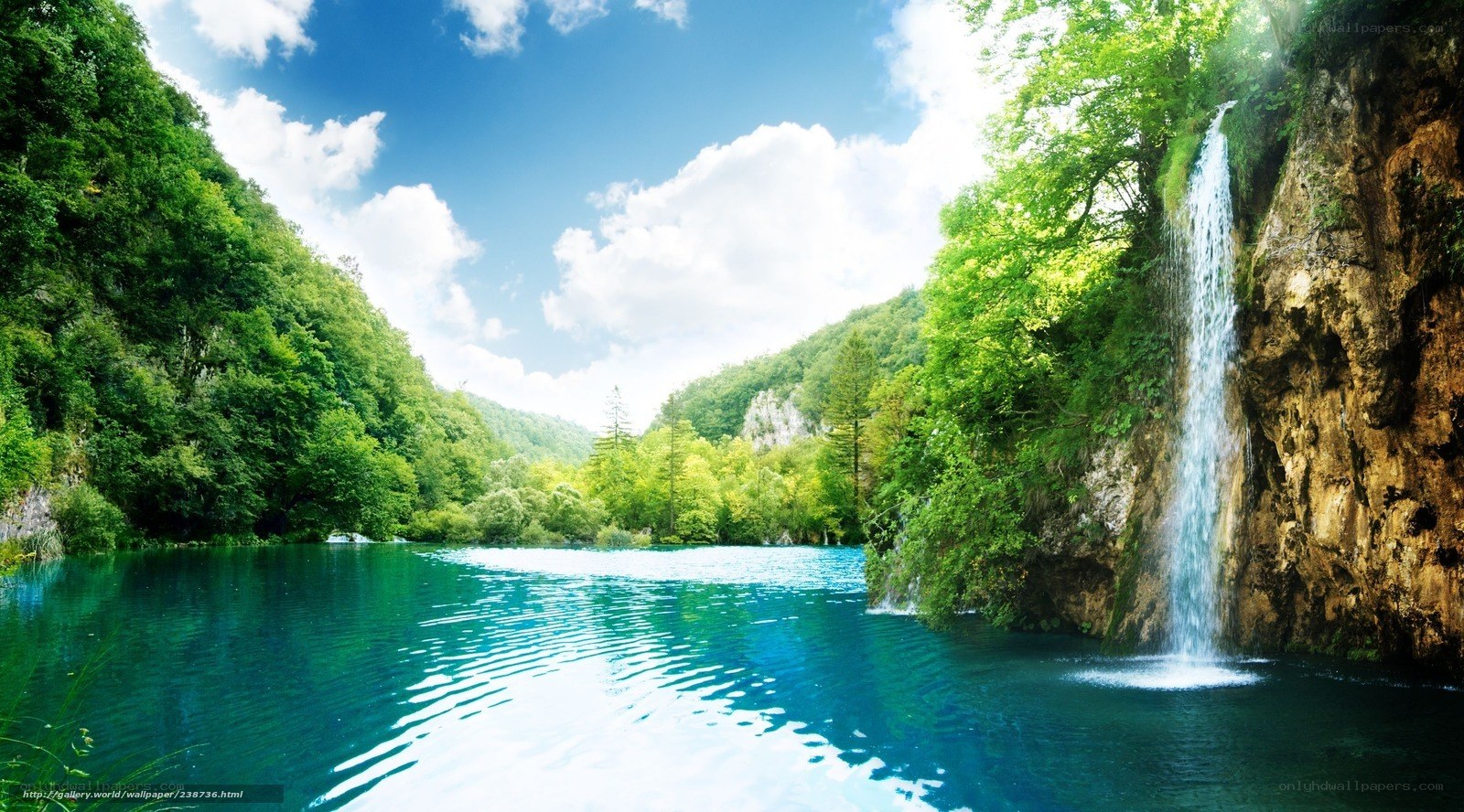 Waterfall in a lush green valley