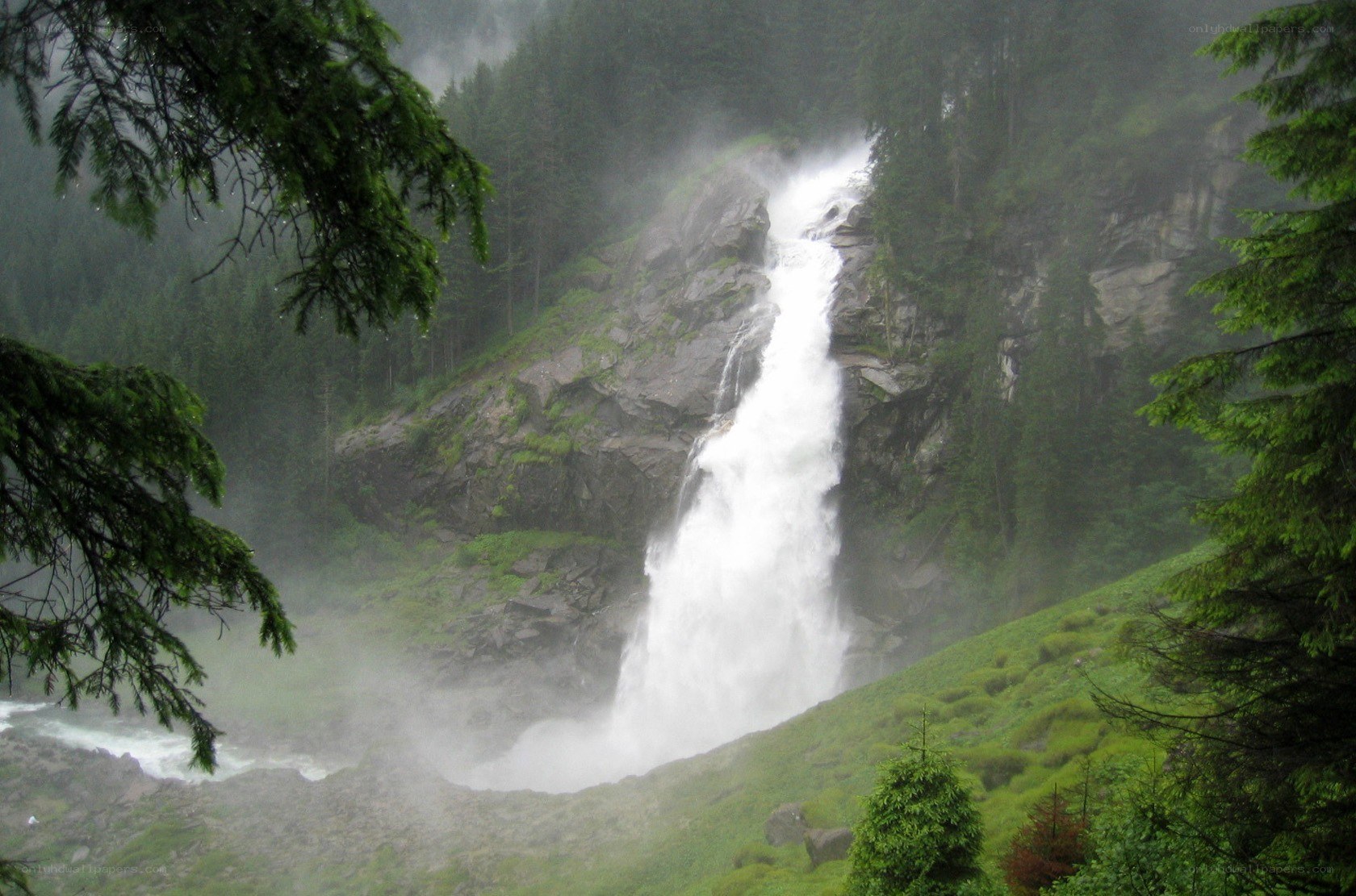 Waterfall in a misty forest