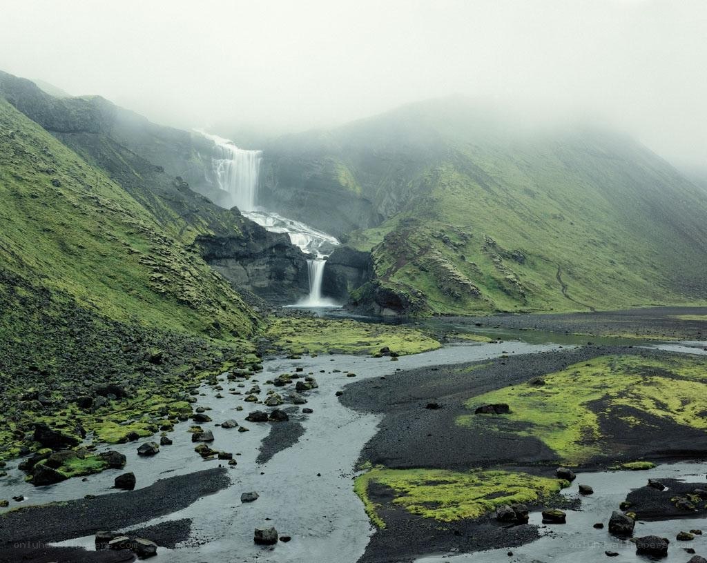 Waterfall in a misty valley