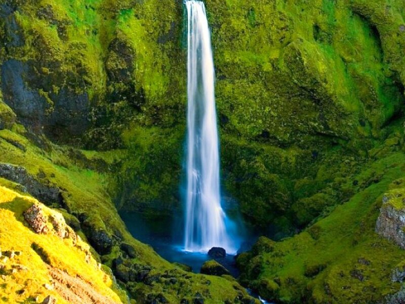 Waterfall in a mossy canyon