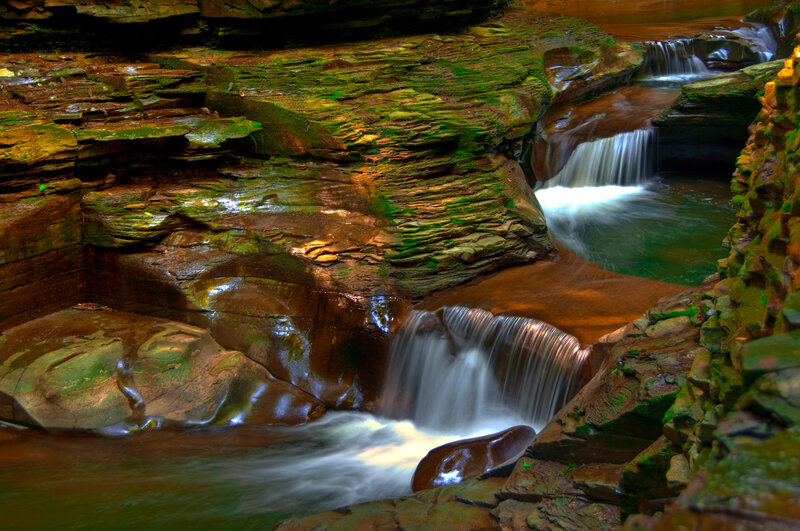 Waterfall in a mossy canyon