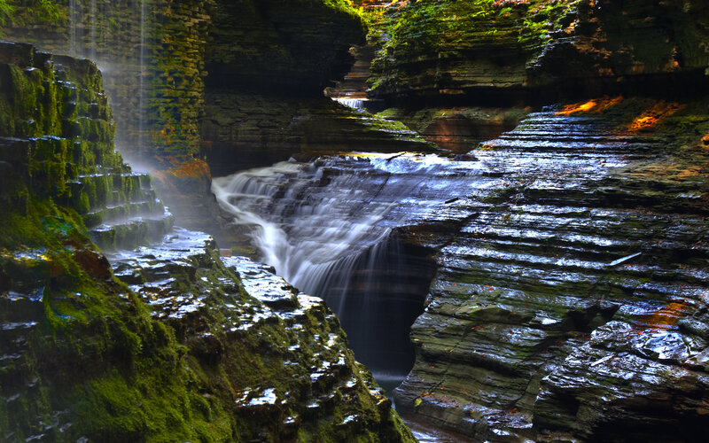 Waterfall in a mossy canyon