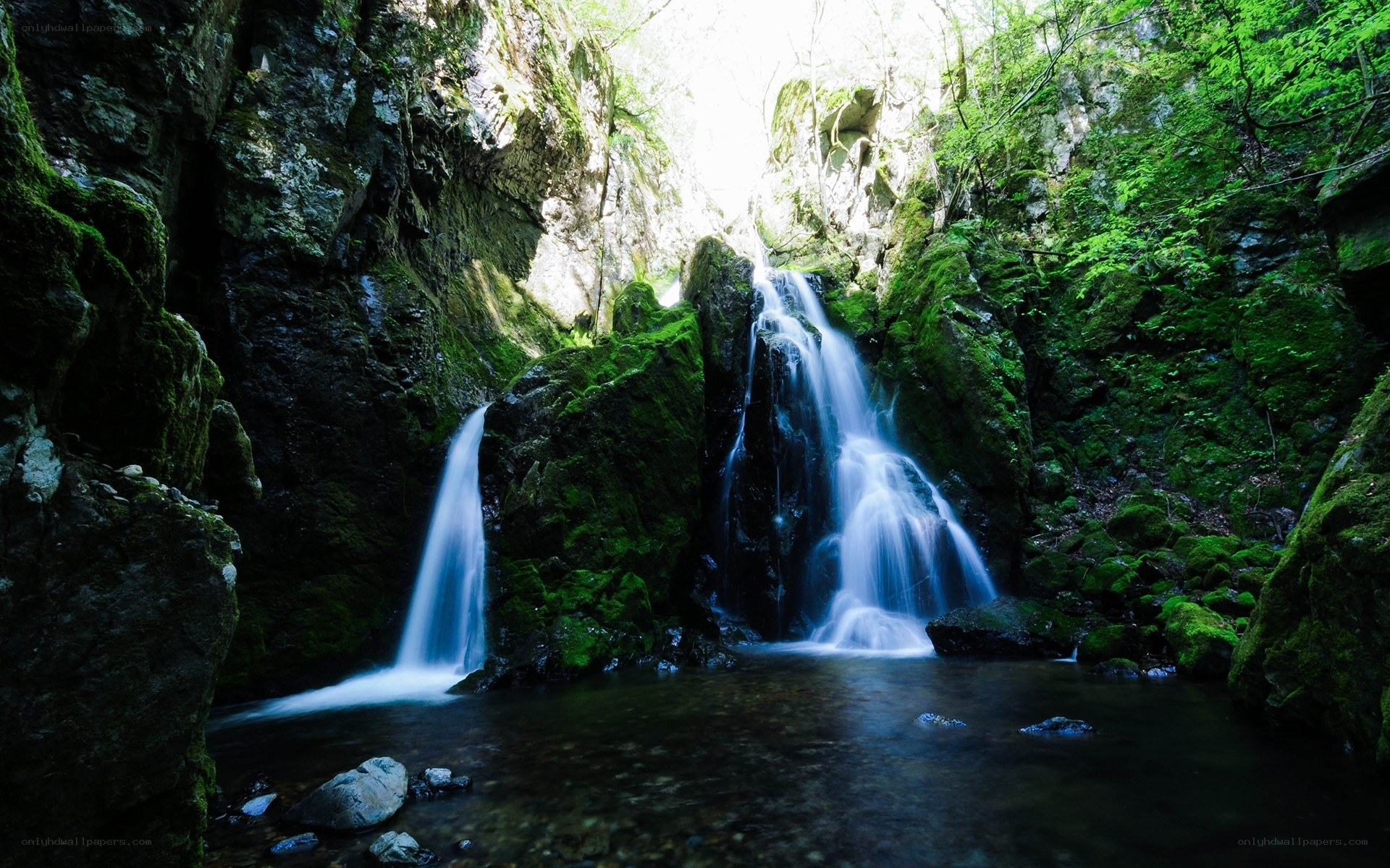 Waterfall in a mossy canyon