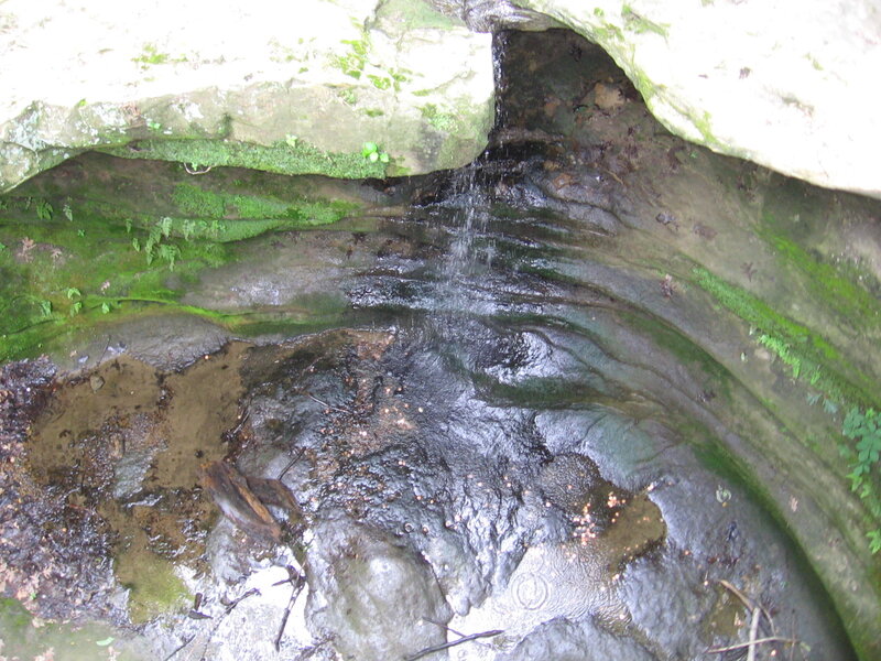 Waterfall in a mossy cave