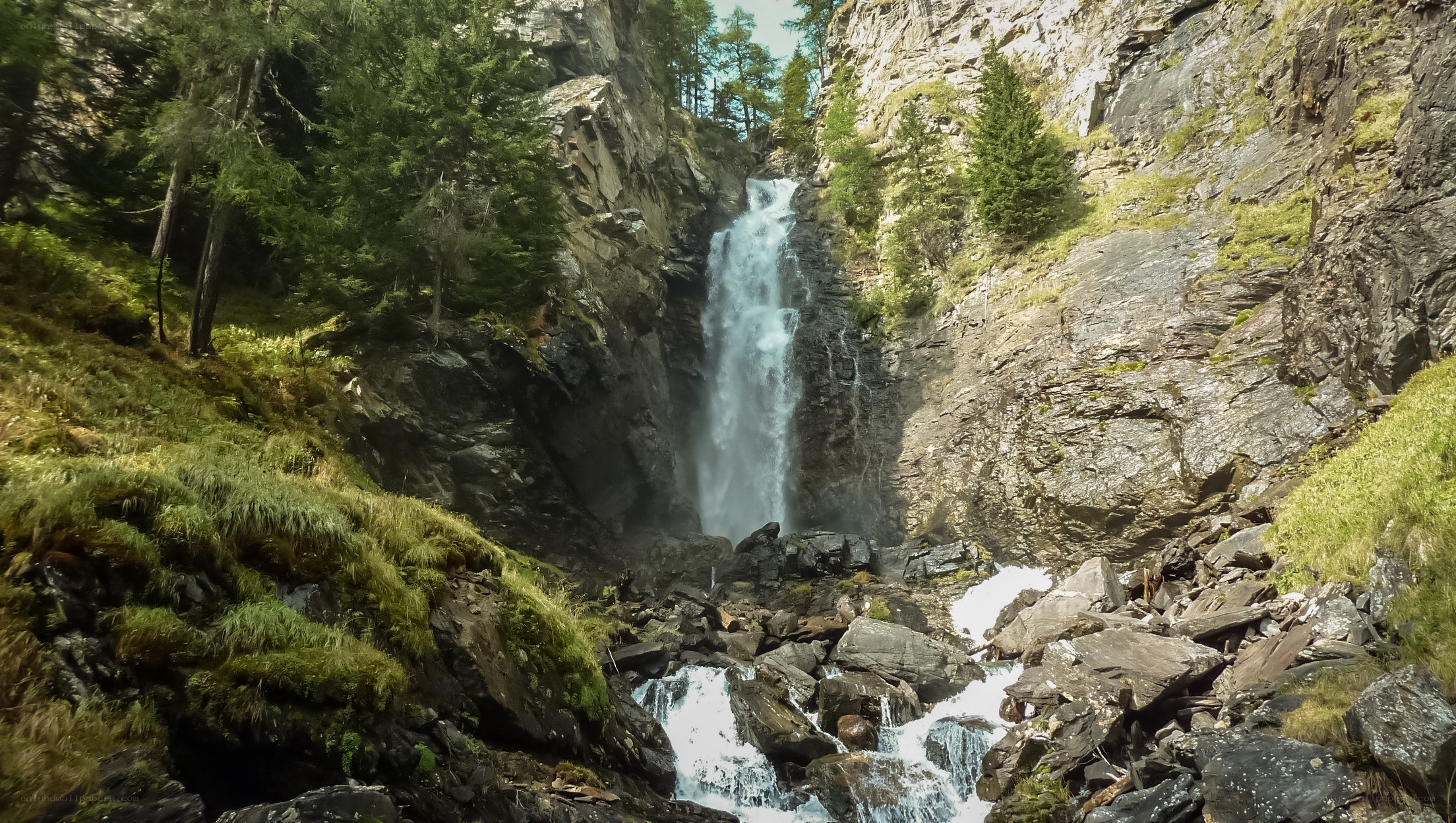 Waterfall in a mountain gorge