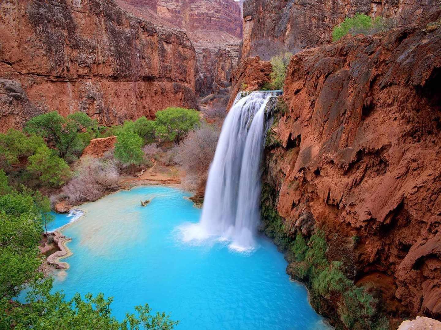 Waterfall in a red canyon