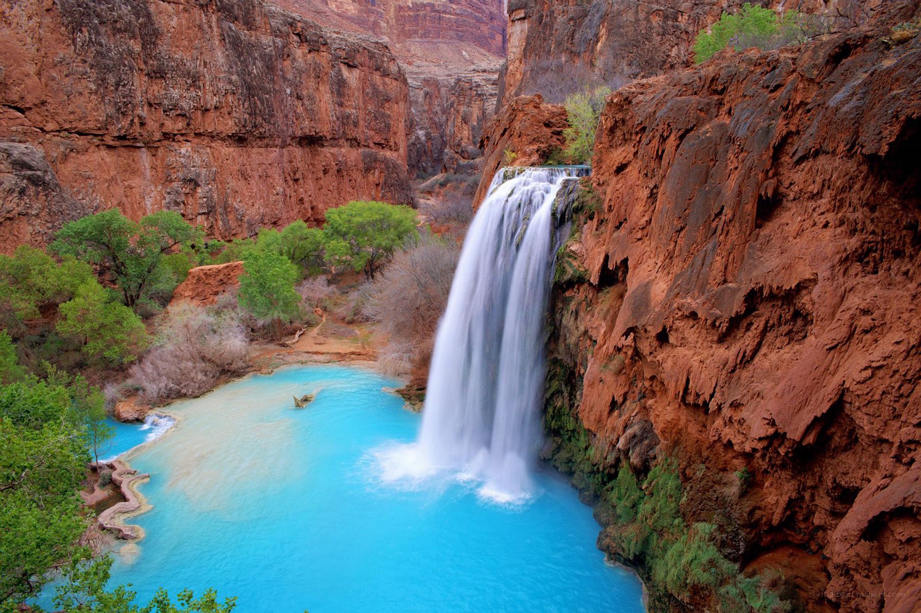 Waterfall in a red canyon