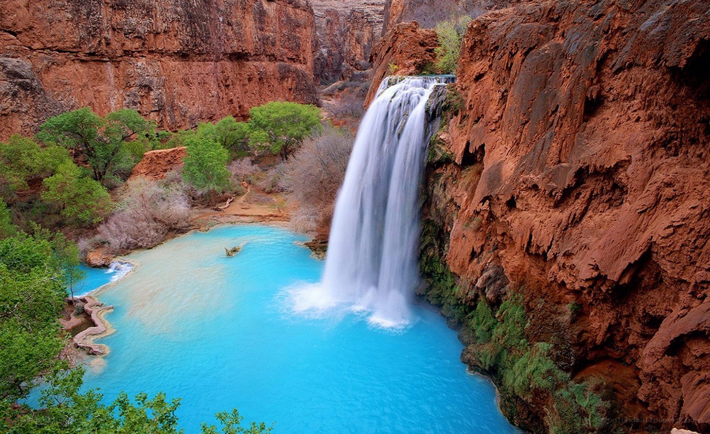 Waterfall in a red canyon