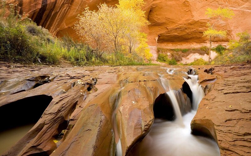 Waterfall in a red rock canyon