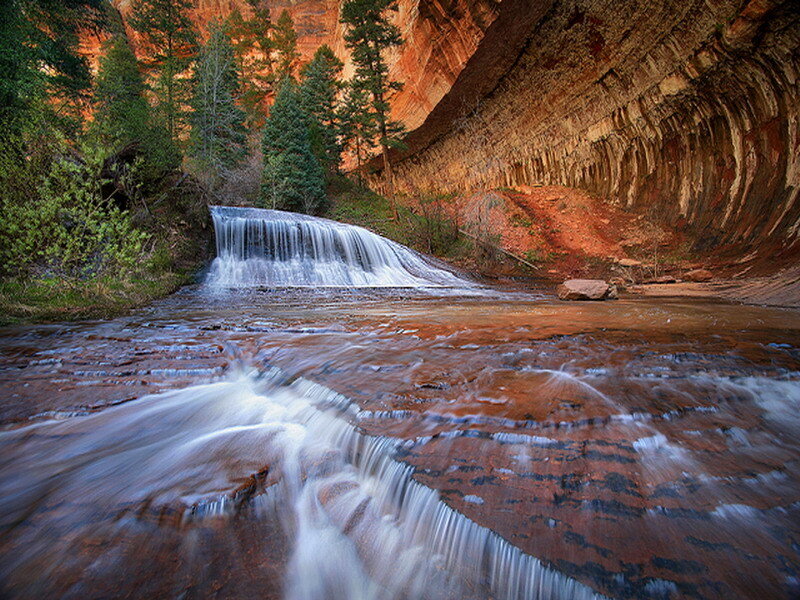 Waterfall in a red rock canyon