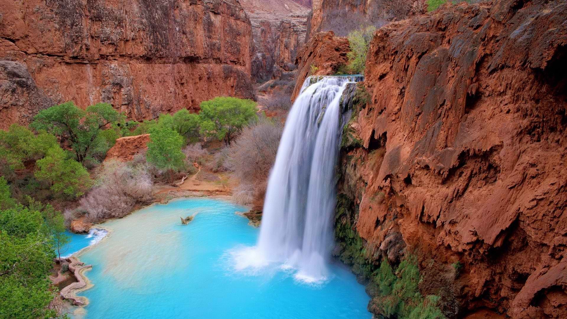 Waterfall in a red rock canyon