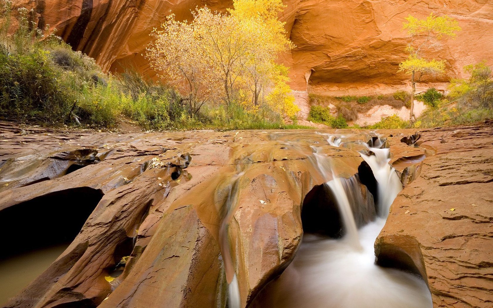 Waterfall in a red rock canyon
