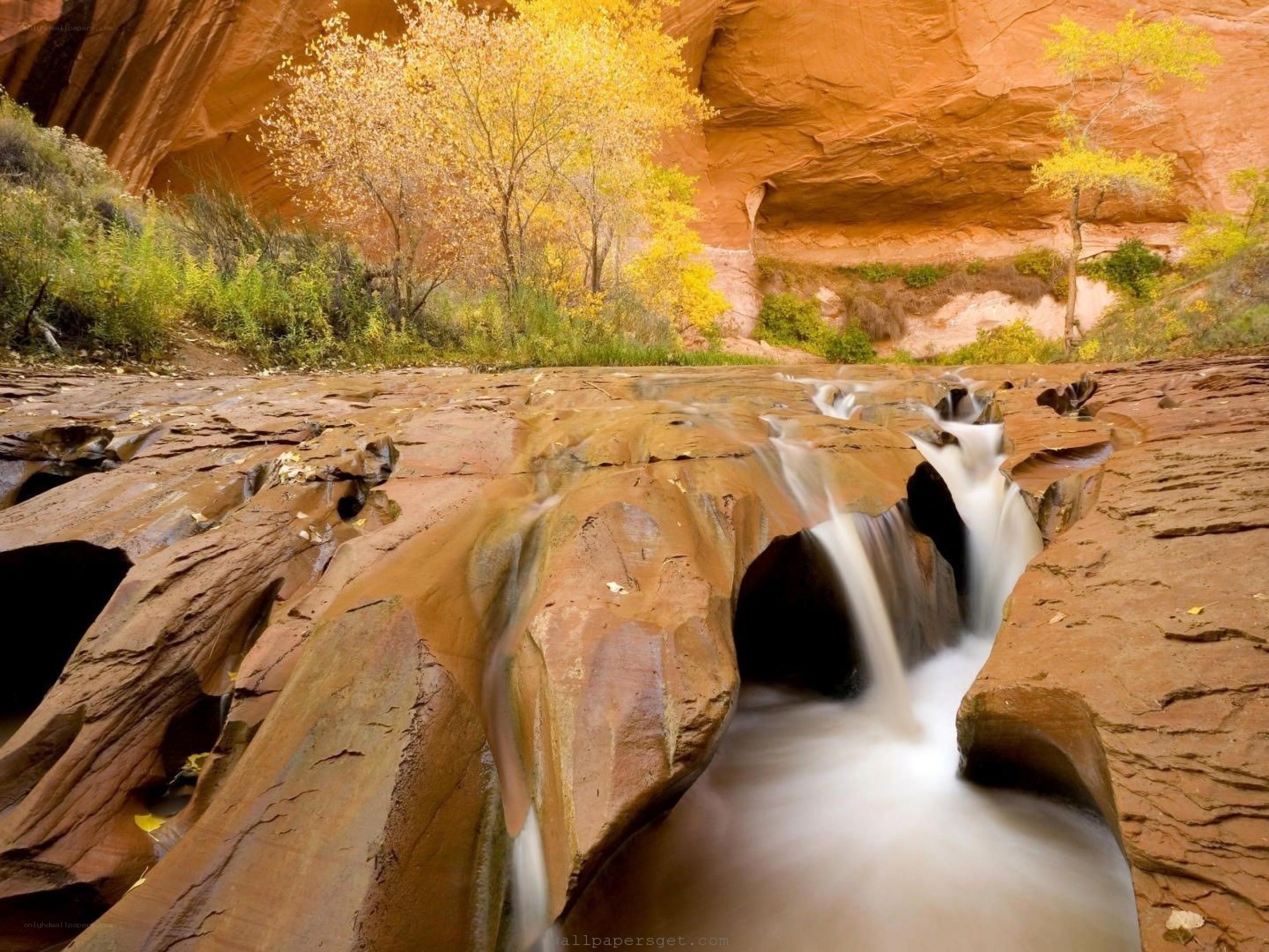 Waterfall in a red rock canyon