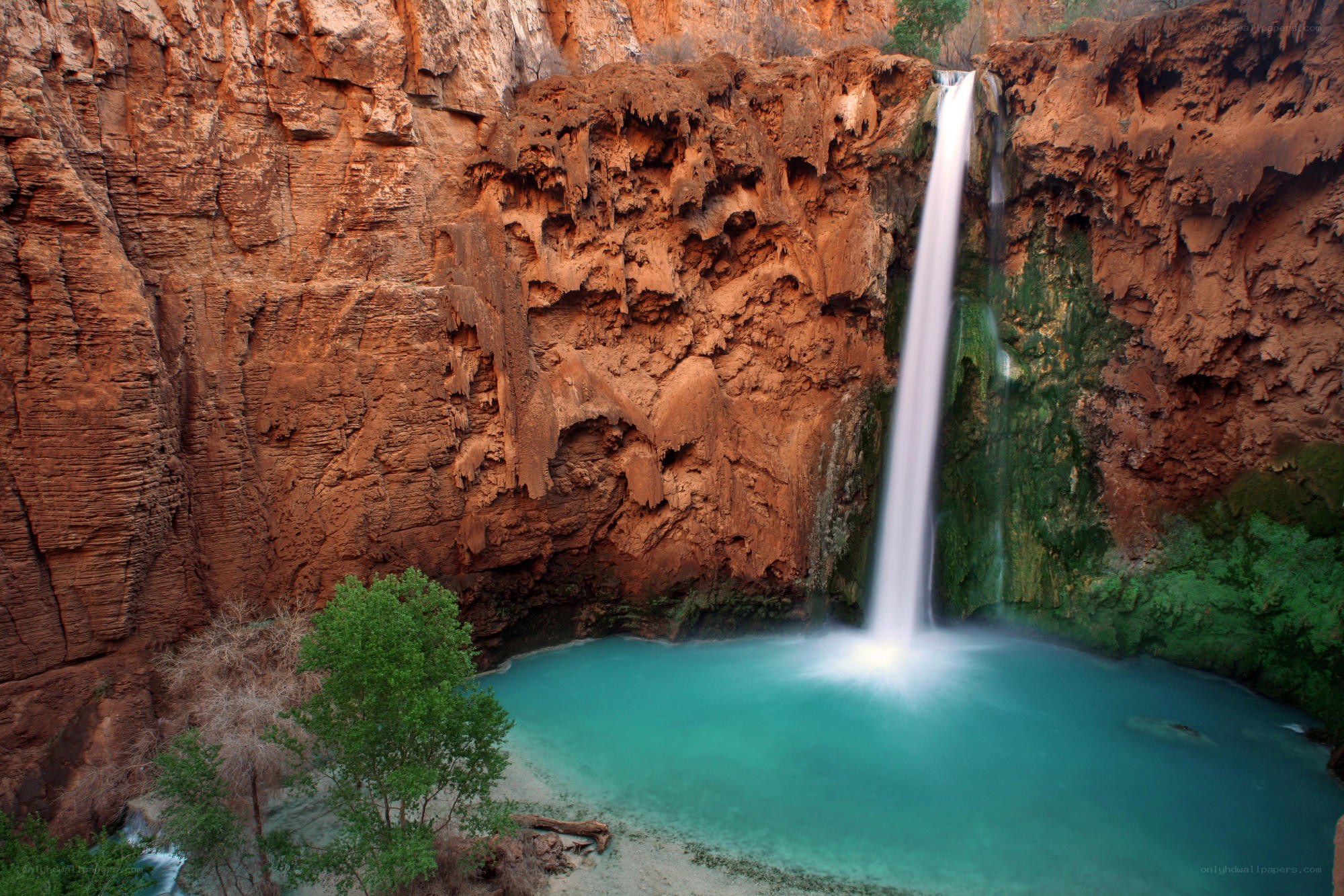Waterfall in a red rock canyon