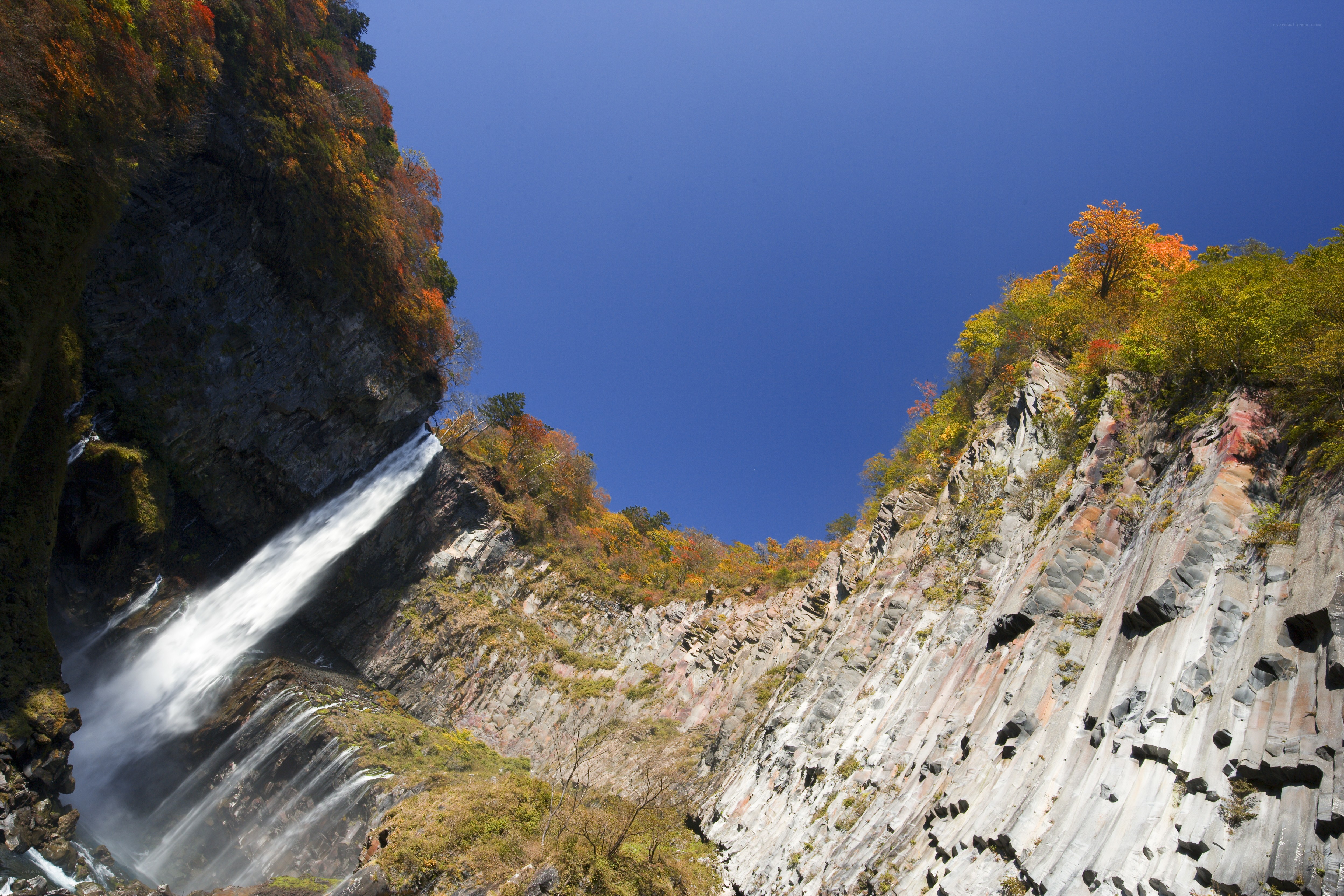 Waterfall in autumn canyon