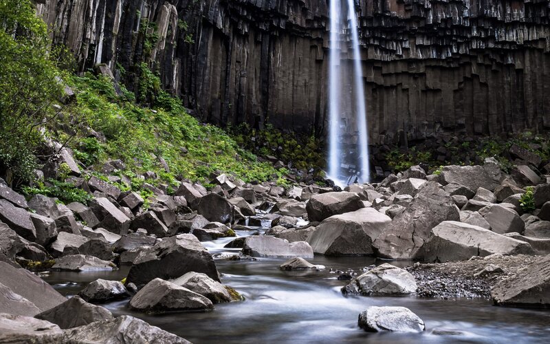 Waterfall in Basalt Cliffs — Black, Serene