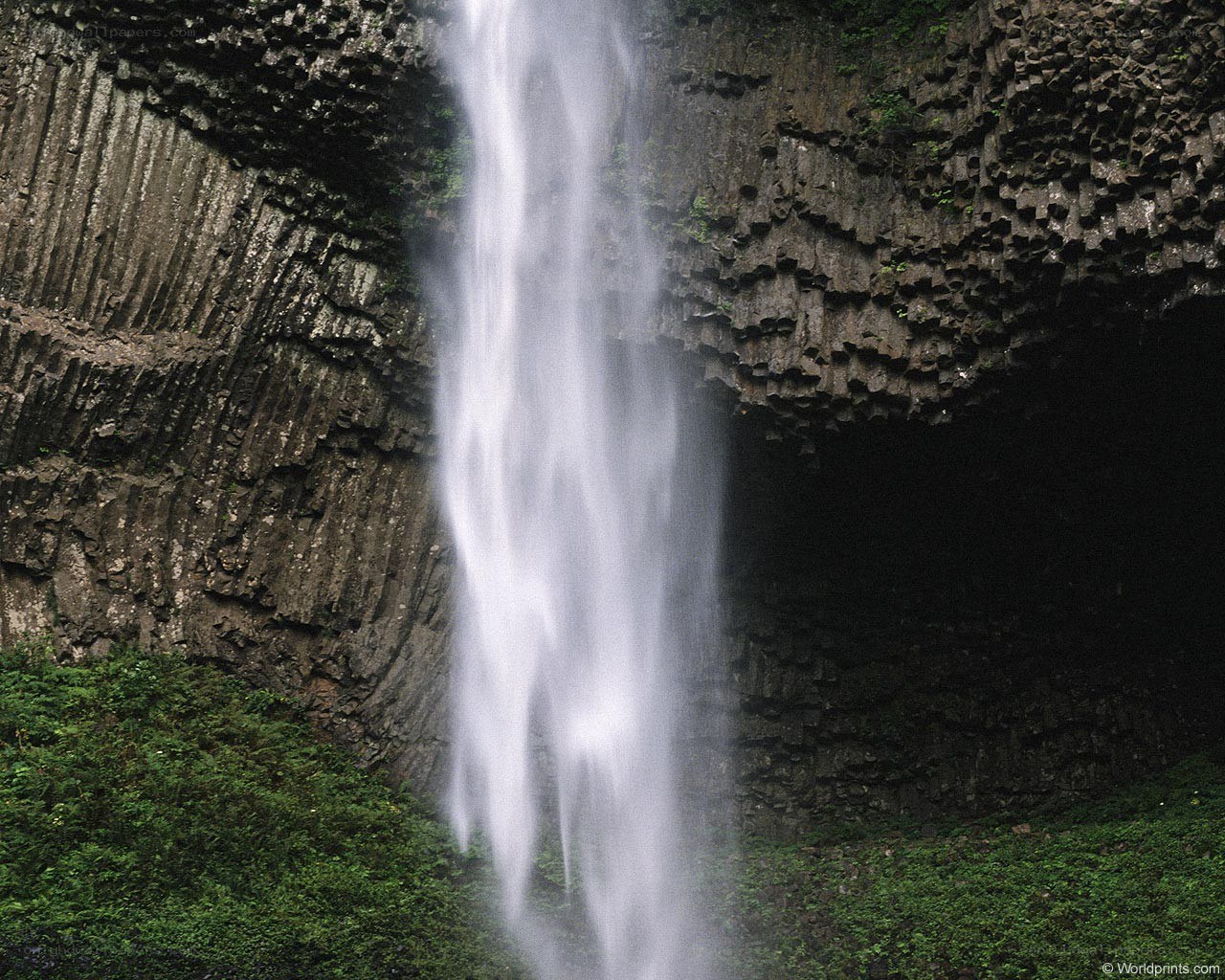 Waterfall in basalt cliffs