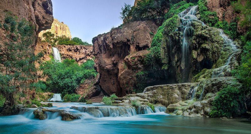 Waterfall in Canyon — Blue, Serene, Afternoon, Photograph, Trees, River, Rocks